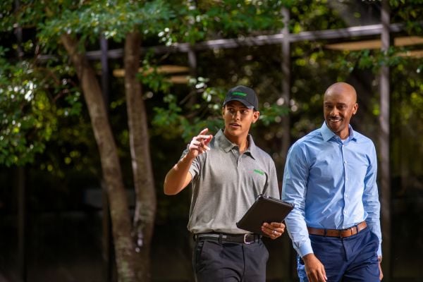 pest technician meeting with a customer