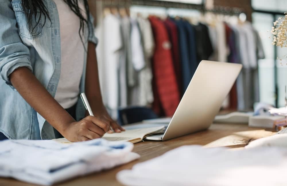 retail store clerk on a laptop