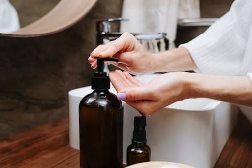 Person applying hand lotion