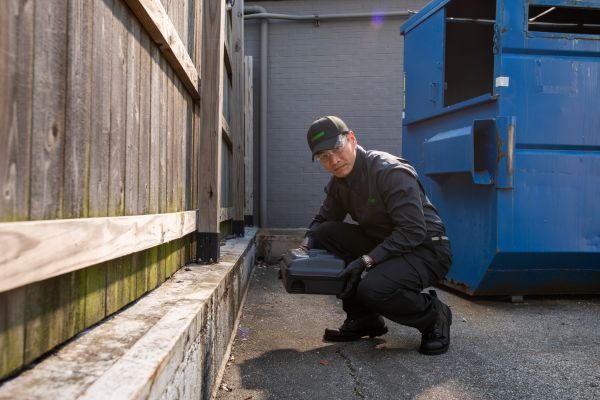 Technician with a rodent box