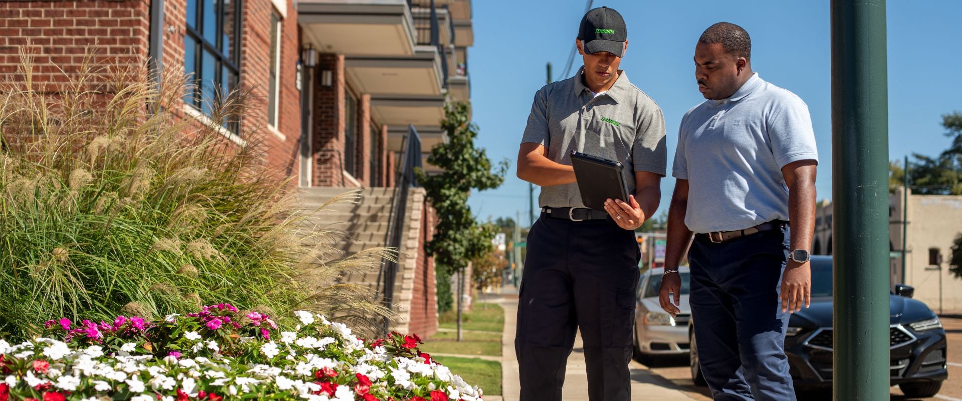 Technician with a customer looking at ipad